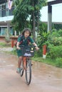 One girl is riding a bicycle.